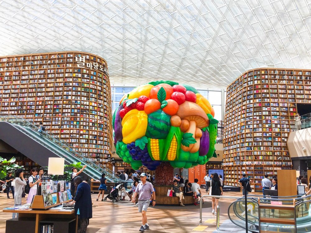 the inside of a large library in Seoul